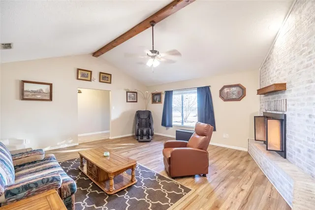 a living room with furniture rug and window