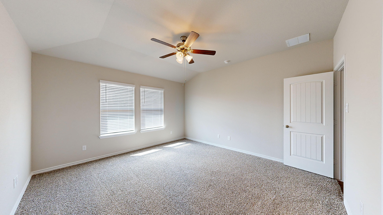 404 Creekfall Road Burnet, TX 78611 - Photo 11 of 23 Empty room with light colored carpet, ceiling fan, and lofted ceiling