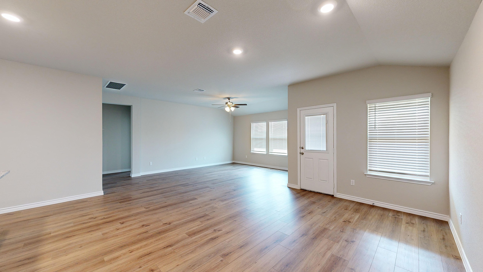 404 Creekfall Road Burnet, TX 78611 - Photo 6 of 23 Spare room with light wood-type flooring, a ceiling fan, vaulted ceiling, and recessed lighting
