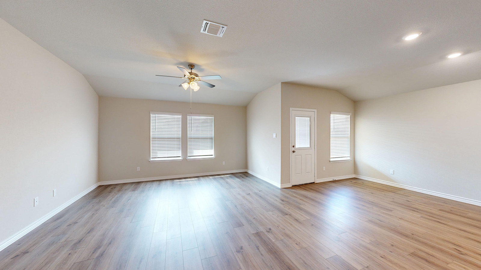 404 Creekfall Road Burnet, TX 78611 - Photo 7 of 23 Spare room with lofted ceiling, a ceiling fan, plenty of natural light, light wood-style flooring, and recessed lighting