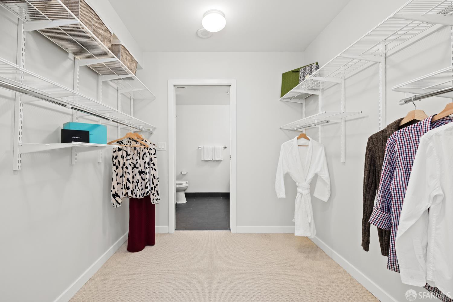 177 Townsend Street, Unit 728 San Francisco, CA 94107 - Photo 13 of 39 a view of walk in closet with clothes and shoes
