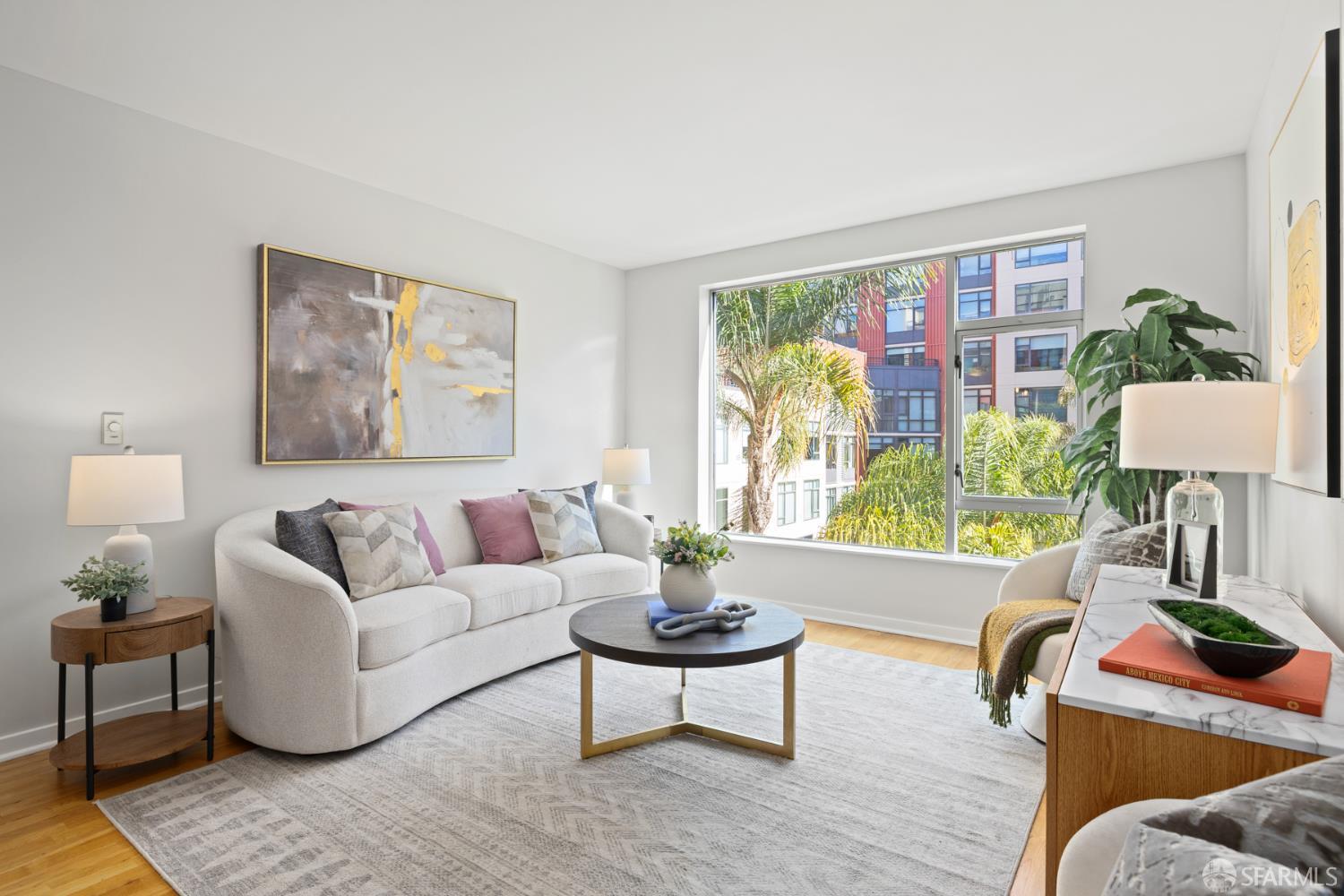 177 Townsend Street, Unit 728 San Francisco, CA 94107 - Photo 2 of 39 a living room with furniture and a large window