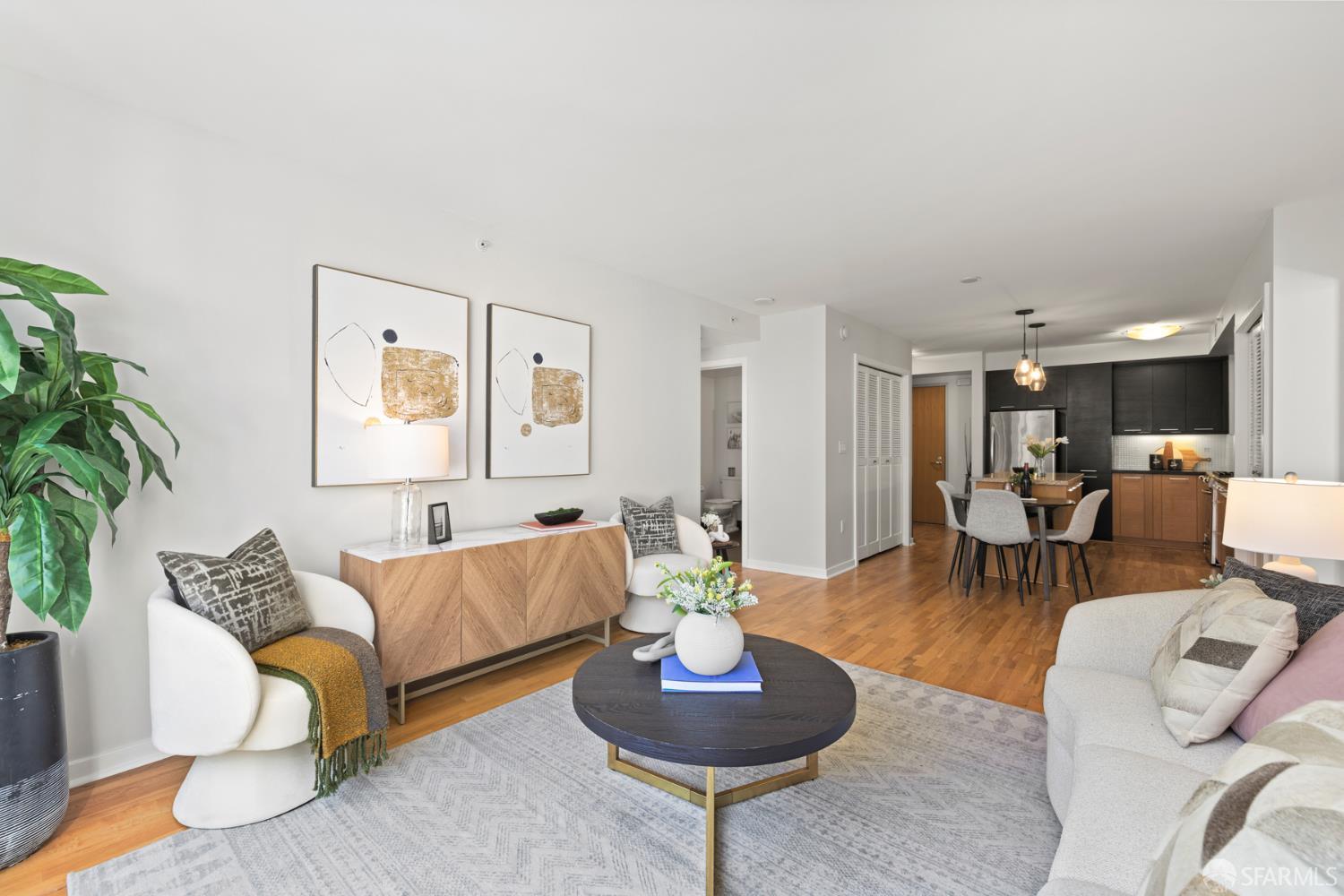177 Townsend Street, Unit 728 San Francisco, CA 94107 - Photo 3 of 39 a living room with furniture and a potted plant