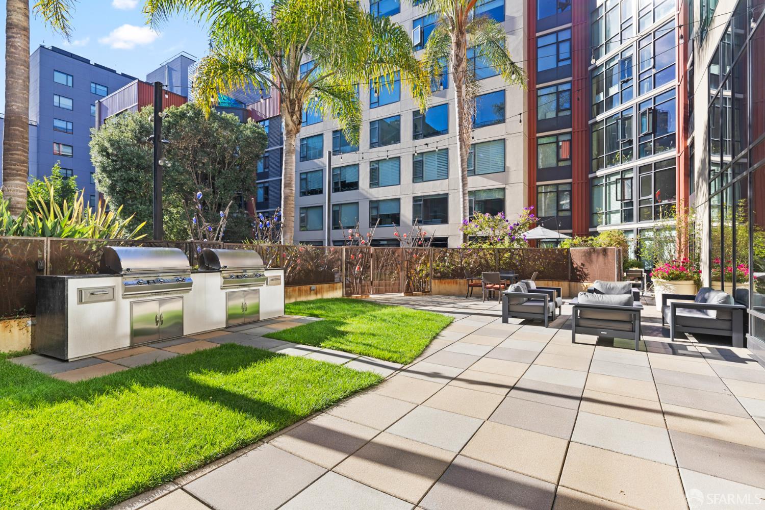 177 Townsend Street, Unit 728 San Francisco, CA 94107 - Photo 34 of 39 a view of a chairs and table in backyard of the house