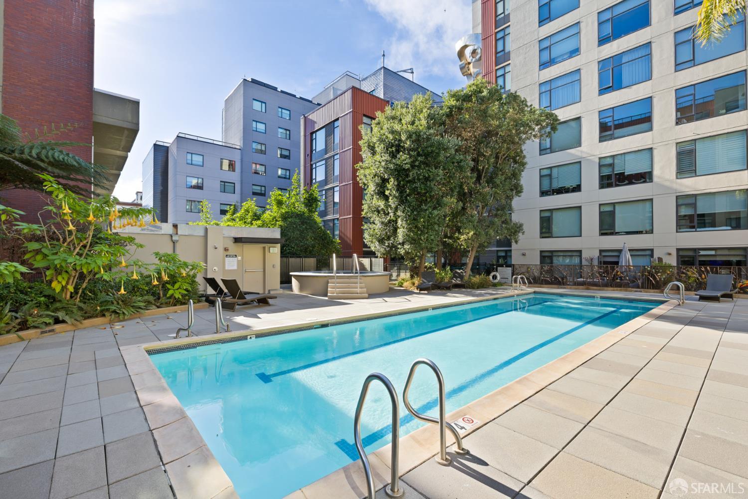 177 Townsend Street, Unit 728 San Francisco, CA 94107 - Photo 36 of 39 a view of a swimming pool with a lounge chairs