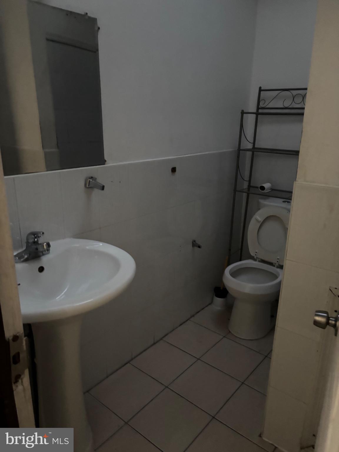 5223 Sylvester Street Philadelphia, PA 19124 - Photo 12 of 12 a bathroom with a sink and a toilet