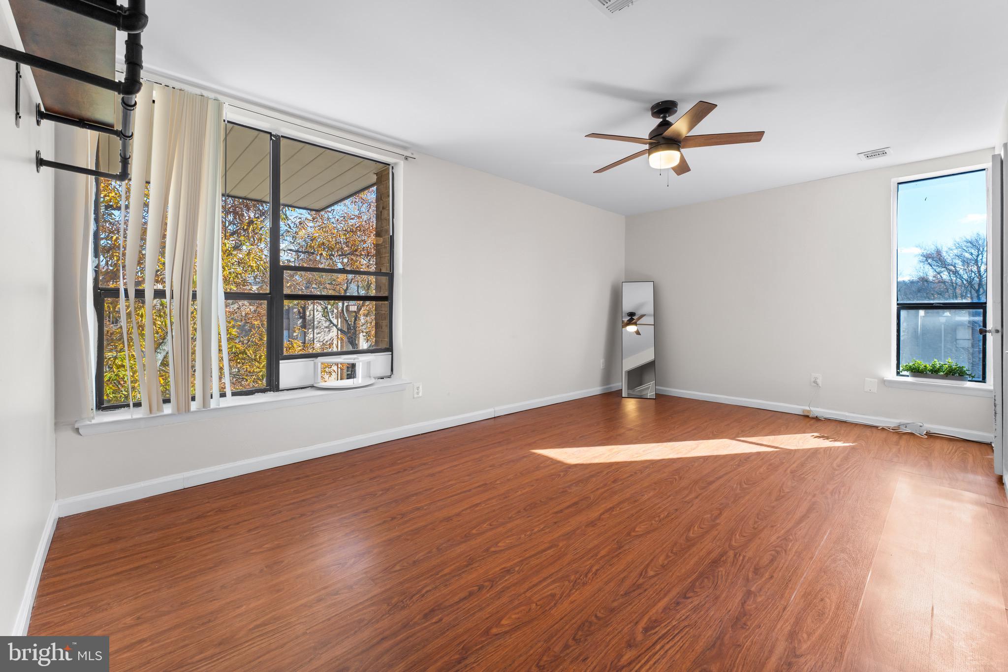 3340 Huntley Square Drive, Unit A Temple Hills, MD 20748 - Photo 12 of 19 a view of empty room with wooden floor and fan
