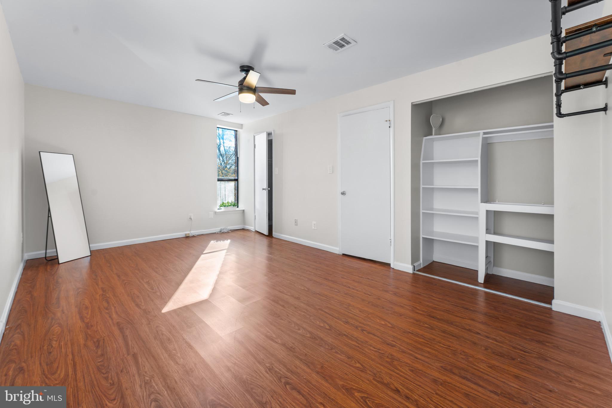 3340 Huntley Square Drive, Unit A Temple Hills, MD 20748 - Photo 14 of 19 a view of empty room with wooden floor and fan