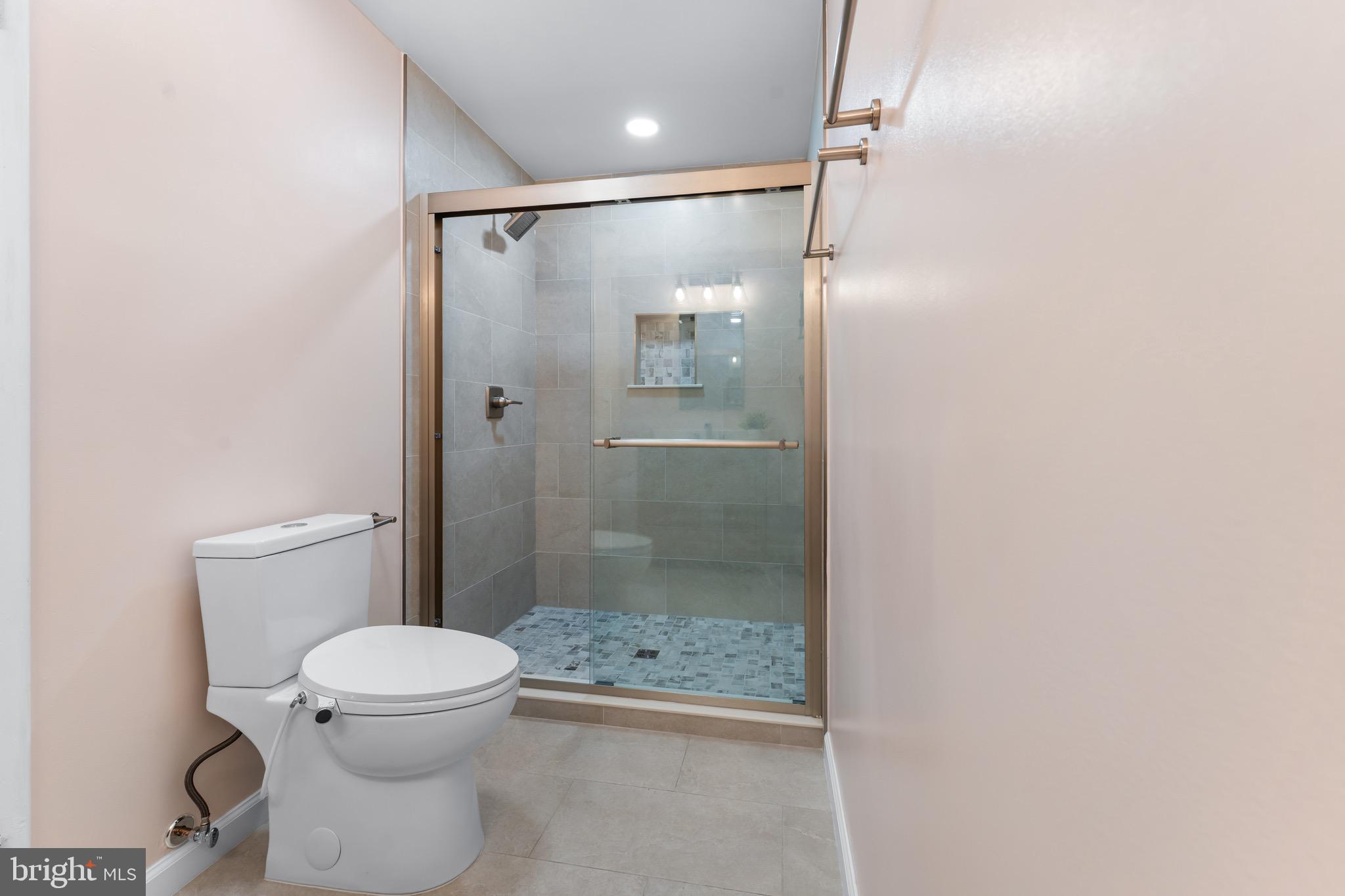 3340 Huntley Square Drive, Unit A Temple Hills, MD 20748 - Photo 10 of 19 a bathroom with a shower and a toilet