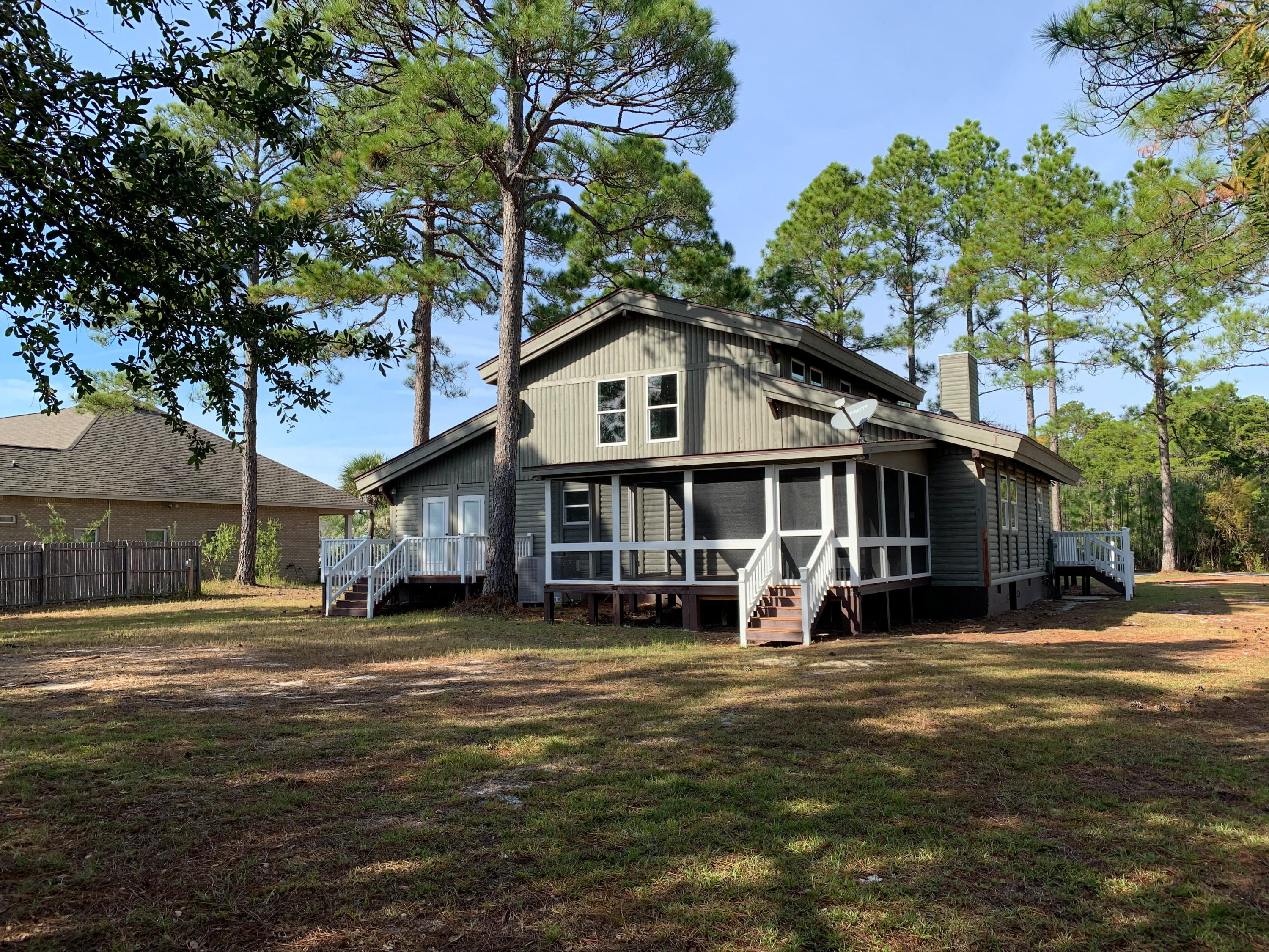 421 Ridge Road Santa Rosa Beach, FL 32459 - Photo 2 of 29 a view of a house with a yard