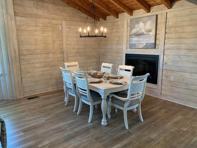 421 Ridge Road Santa Rosa Beach, FL 32459 - Photo 23 of 29 a dining room with furniture and wooden floor