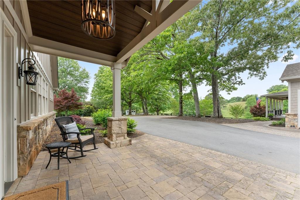 4601 North Browning Bridge Road Gainesville, GA 30506 - Photo 47 of 80 a building outdoor space with patio furniture and potted plants
