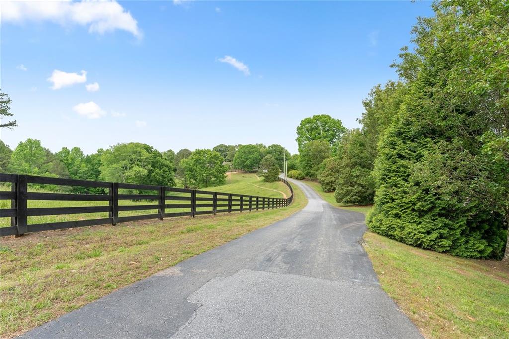 4601 North Browning Bridge Road Gainesville, GA 30506 - Photo 51 of 80 a view of a pathway with a garden