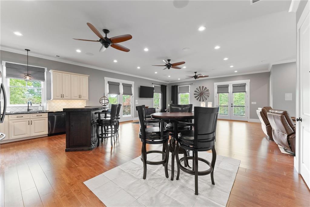 4601 North Browning Bridge Road Gainesville, GA 30506 - Photo 53 of 80 a view of a dining room with furniture and wooden floor