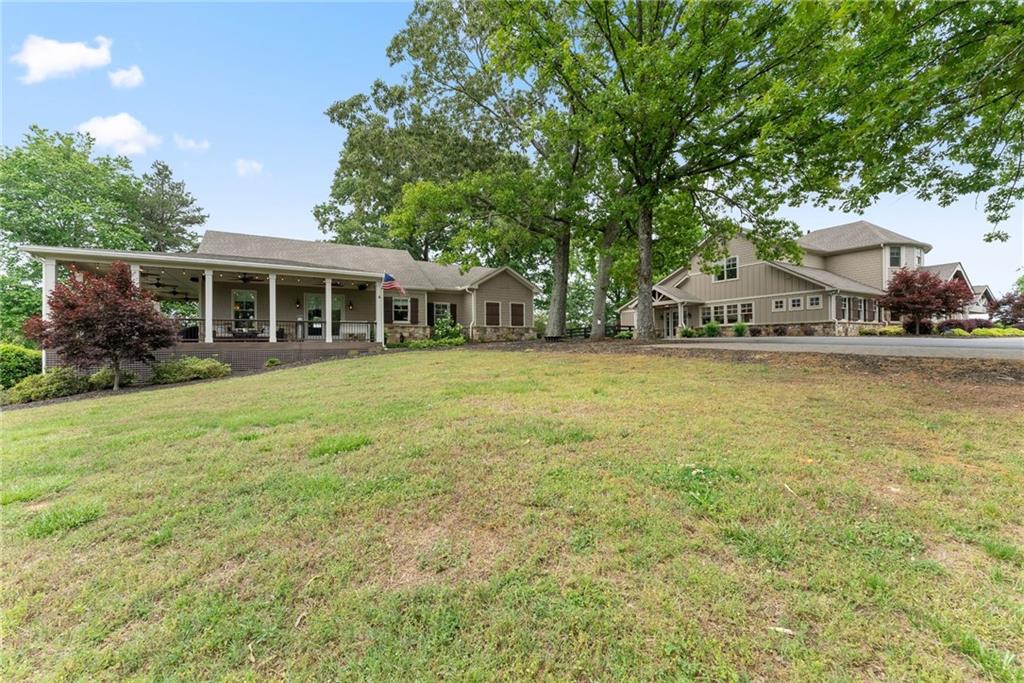 4601 North Browning Bridge Road Gainesville, GA 30506 - Photo 59 of 80 a view of a house with garden and sitting area