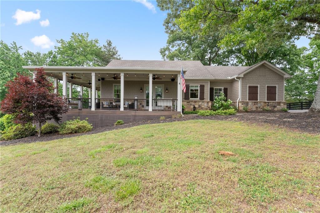 4601 North Browning Bridge Road Gainesville, GA 30506 - Photo 60 of 80 a front view of house with yard and outdoor seating