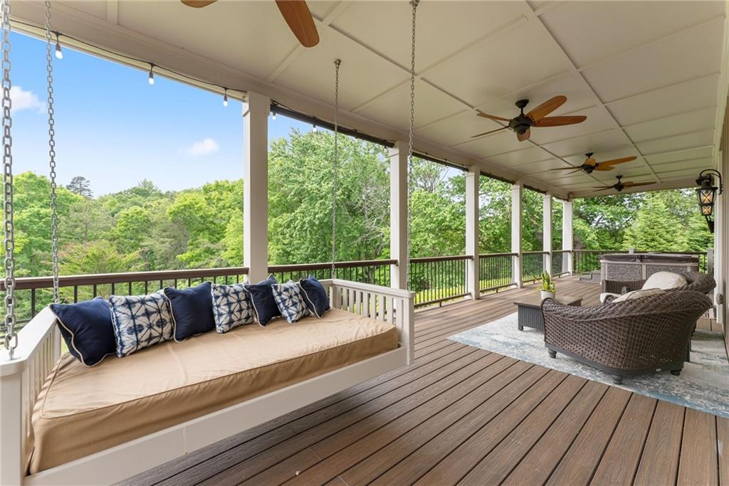 4601 North Browning Bridge Road Gainesville, GA 30506 - Photo 61 of 80 a balcony with furniture and wooden floor