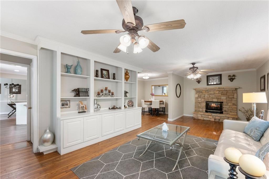4601 North Browning Bridge Road Gainesville, GA 30506 - Photo 65 of 80 a living room with furniture and a fireplace