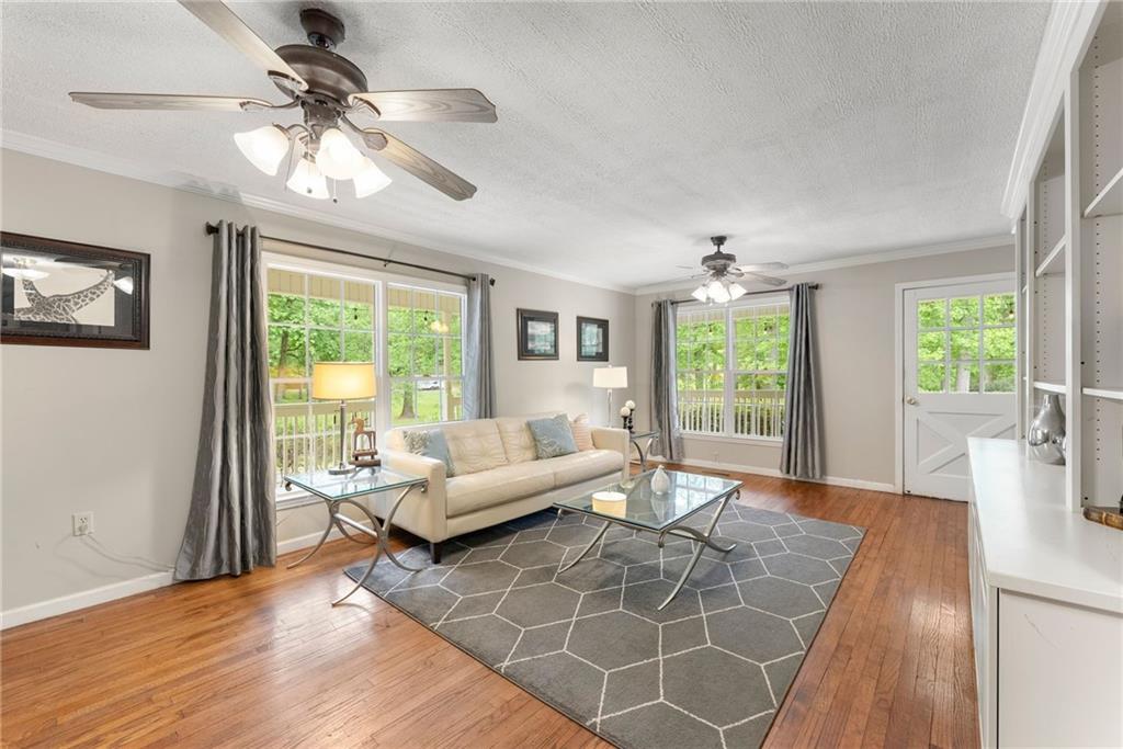 4601 North Browning Bridge Road Gainesville, GA 30506 - Photo 66 of 80 a living room with furniture and a large window