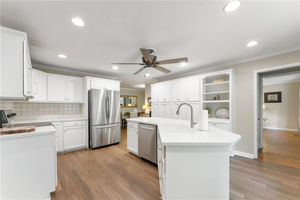 4601 North Browning Bridge Road Gainesville, GA 30506 - Photo 67 of 80 a kitchen with refrigerator cabinets and a sink