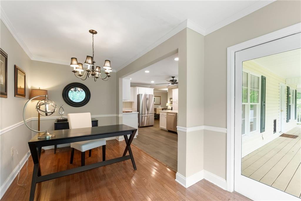 4601 North Browning Bridge Road Gainesville, GA 30506 - Photo 69 of 80 a view of a very nice looking dining room with furniture a chandelier and wooden floor