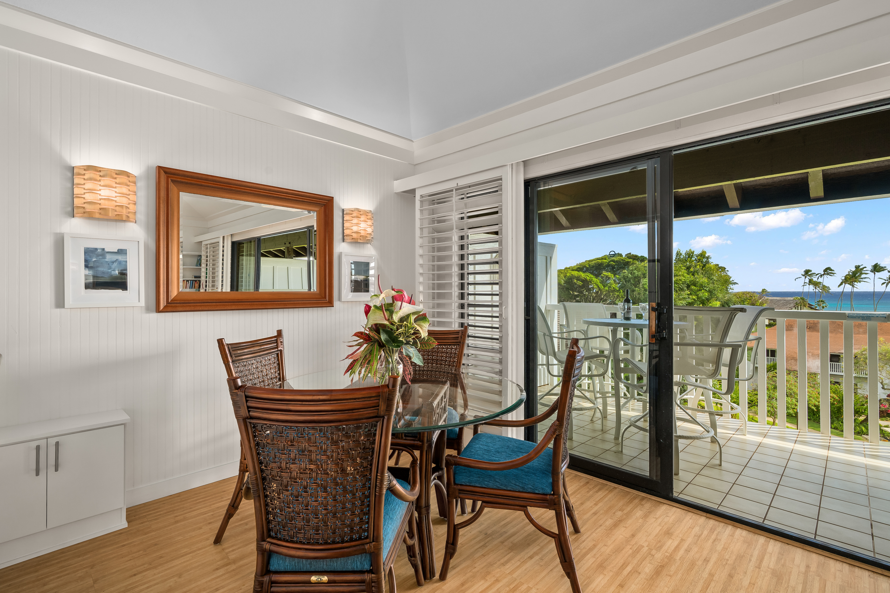 2253 Poipu Road, Unit 123 Koloa, HI 96756 - Photo 13 of 25 a dining room with furniture and wooden floor