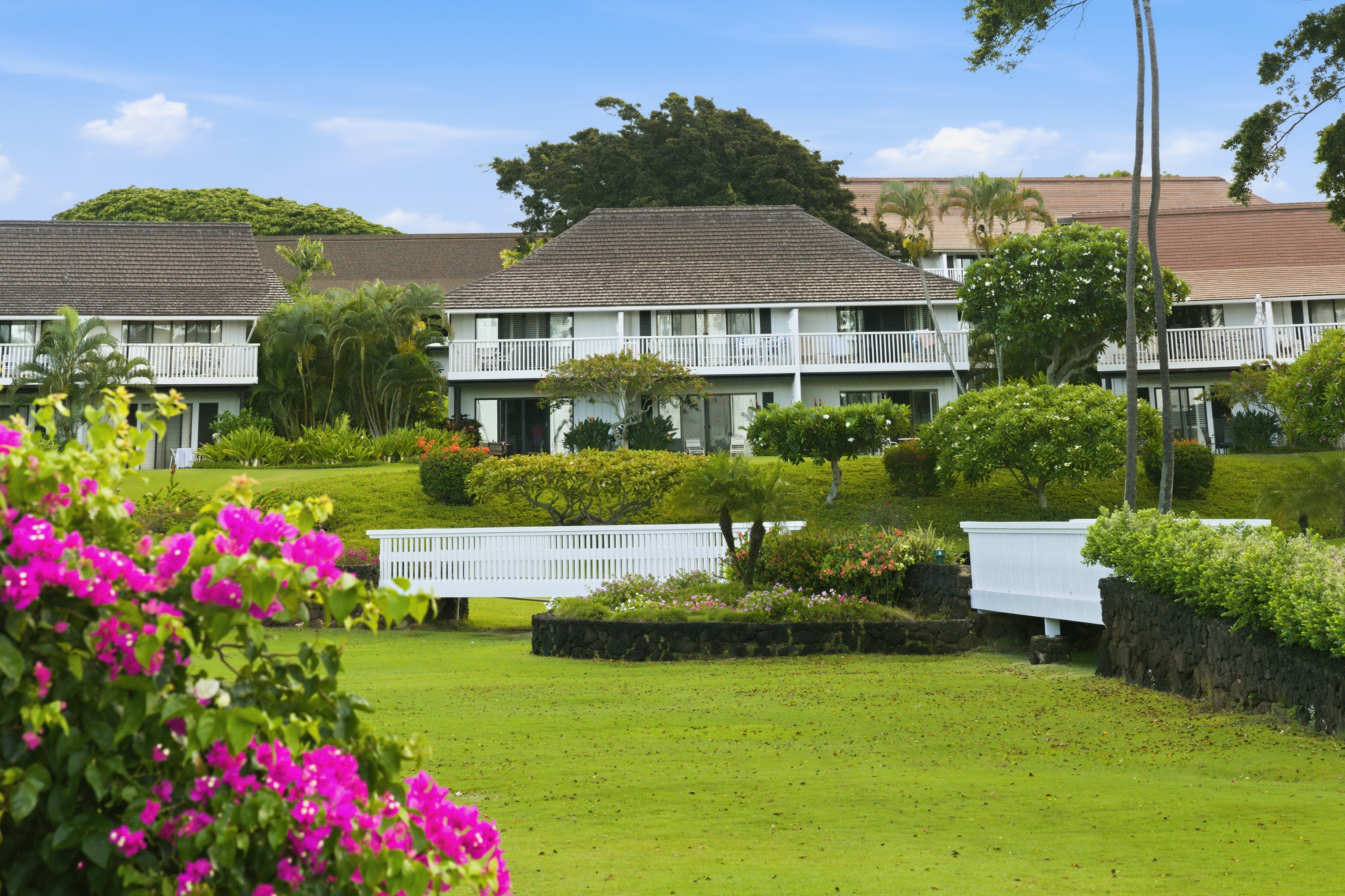 2253 Poipu Road, Unit 123 Koloa, HI 96756 - Photo 24 of 25 a front view of house with yard and green space