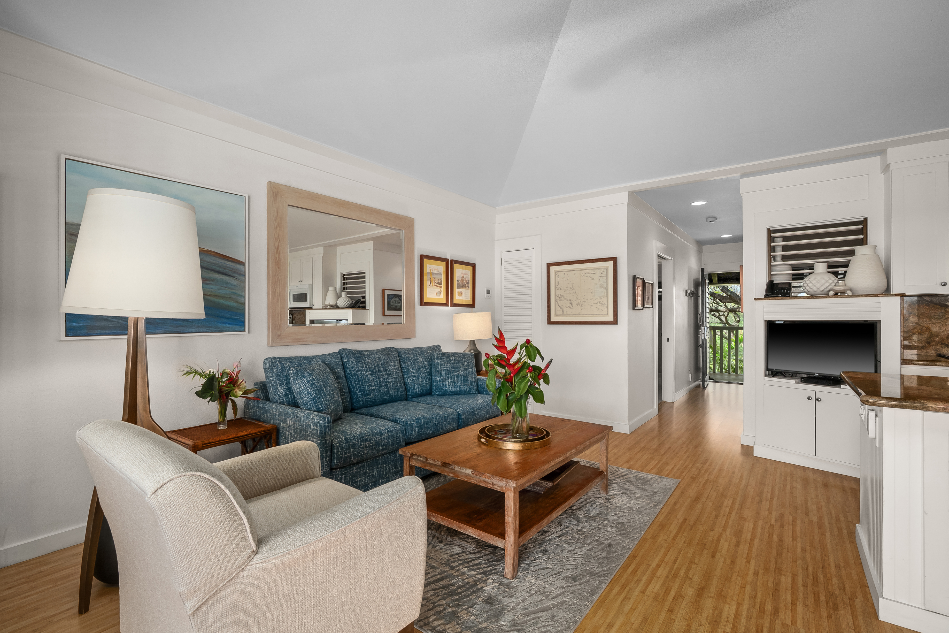 2253 Poipu Road, Unit 123 Koloa, HI 96756 - Photo 4 of 25 a living room with furniture and a wooden floor