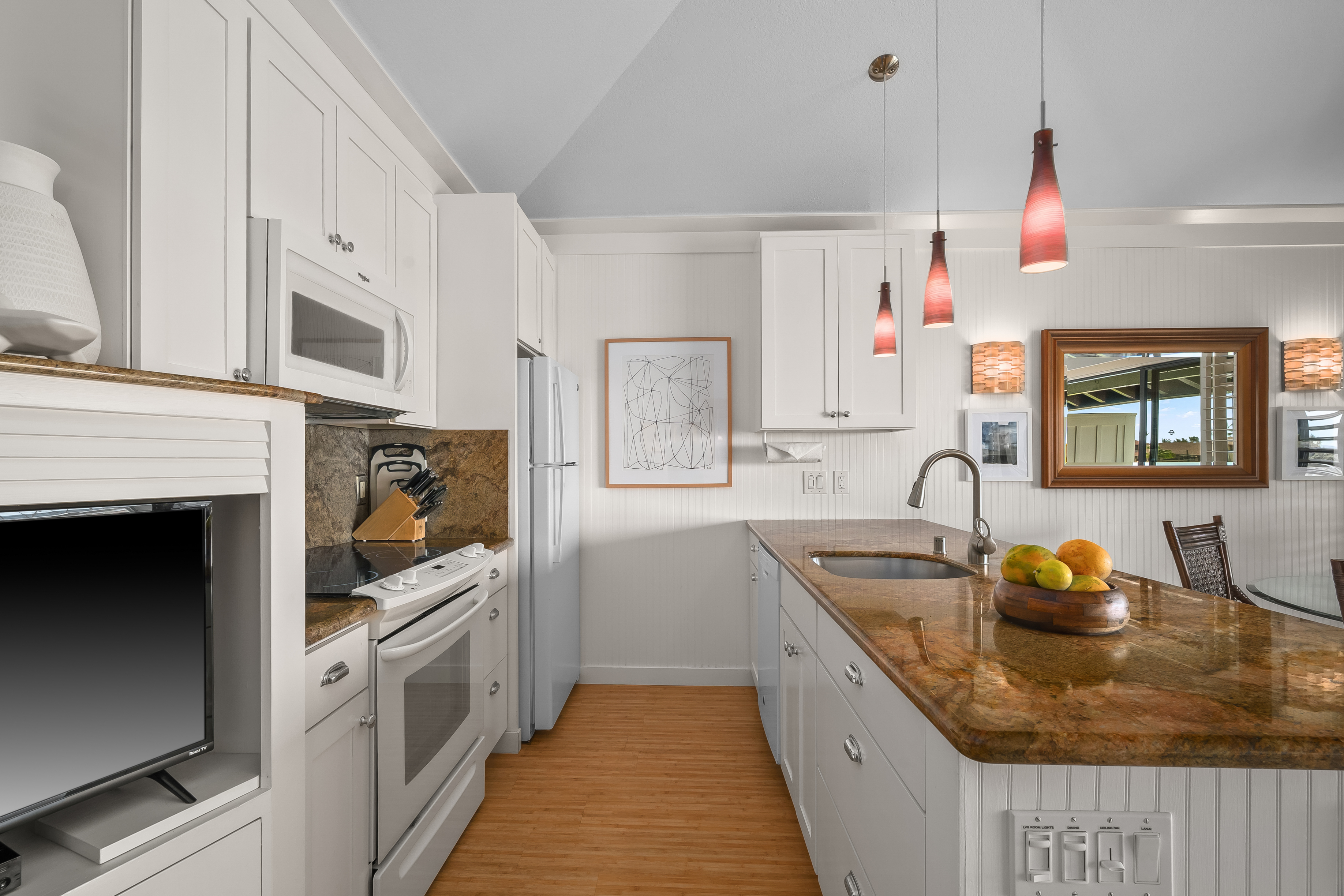 2253 Poipu Road, Unit 123 Koloa, HI 96756 - Photo 8 of 25 a kitchen with granite countertop a sink stainless steel appliances and cabinets