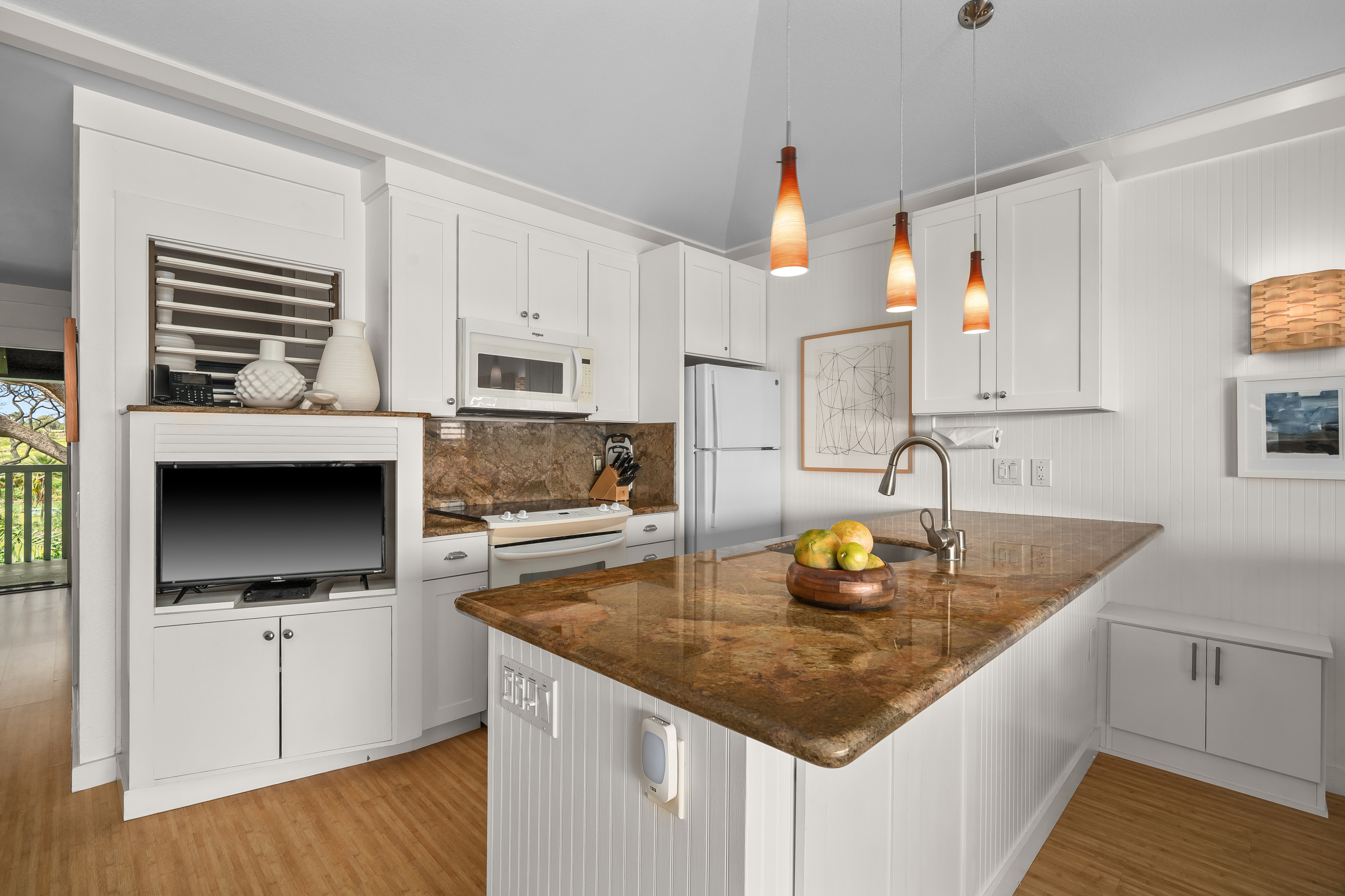 2253 Poipu Road, Unit 123 Koloa, HI 96756 - Photo 9 of 25 a kitchen with stainless steel appliances granite countertop a sink stove and cabinets
