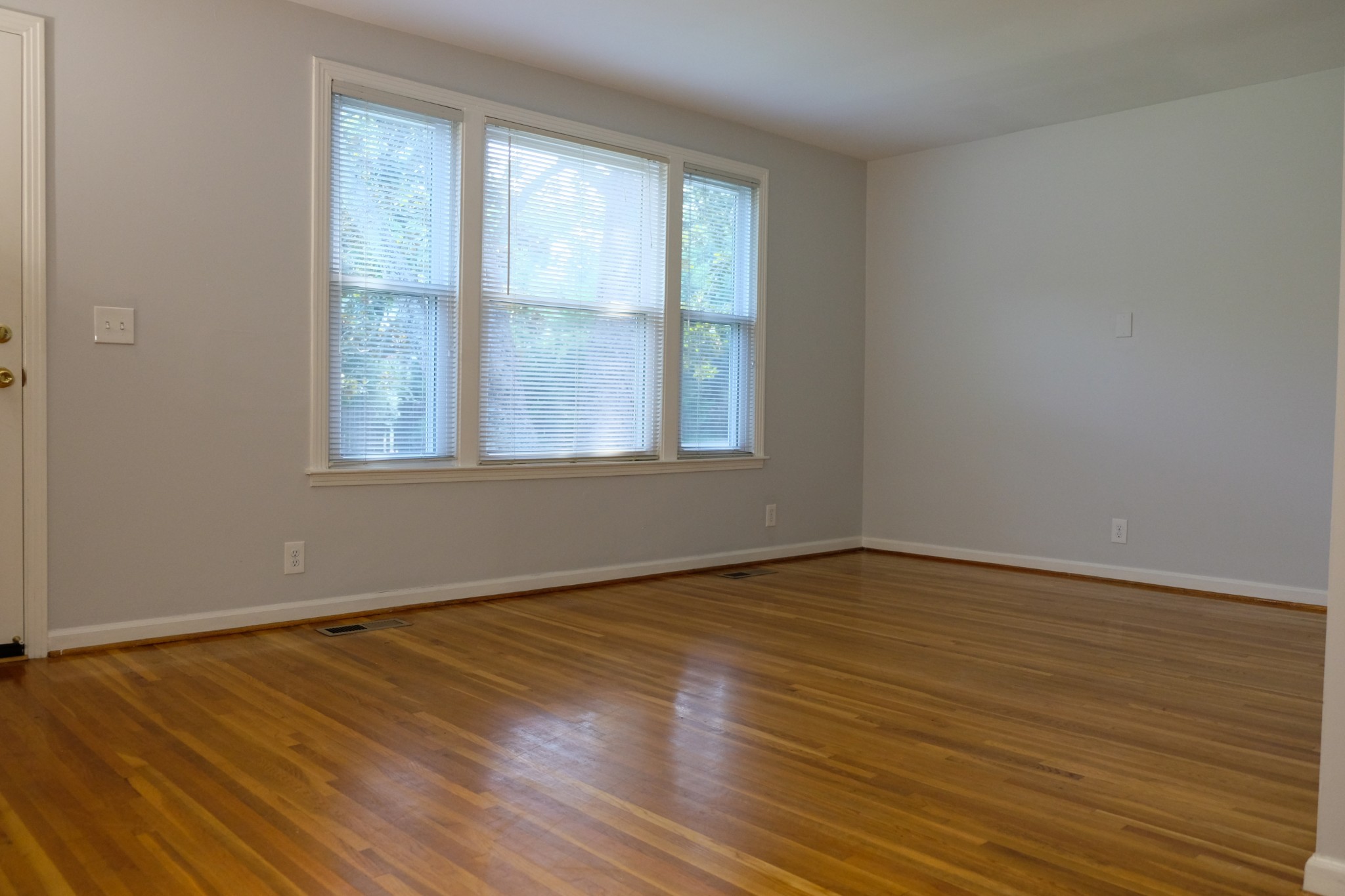 2810 Valley Road Nashville, TN 37215 - Photo 2 of 10 a view of an empty room with wooden floor and a window