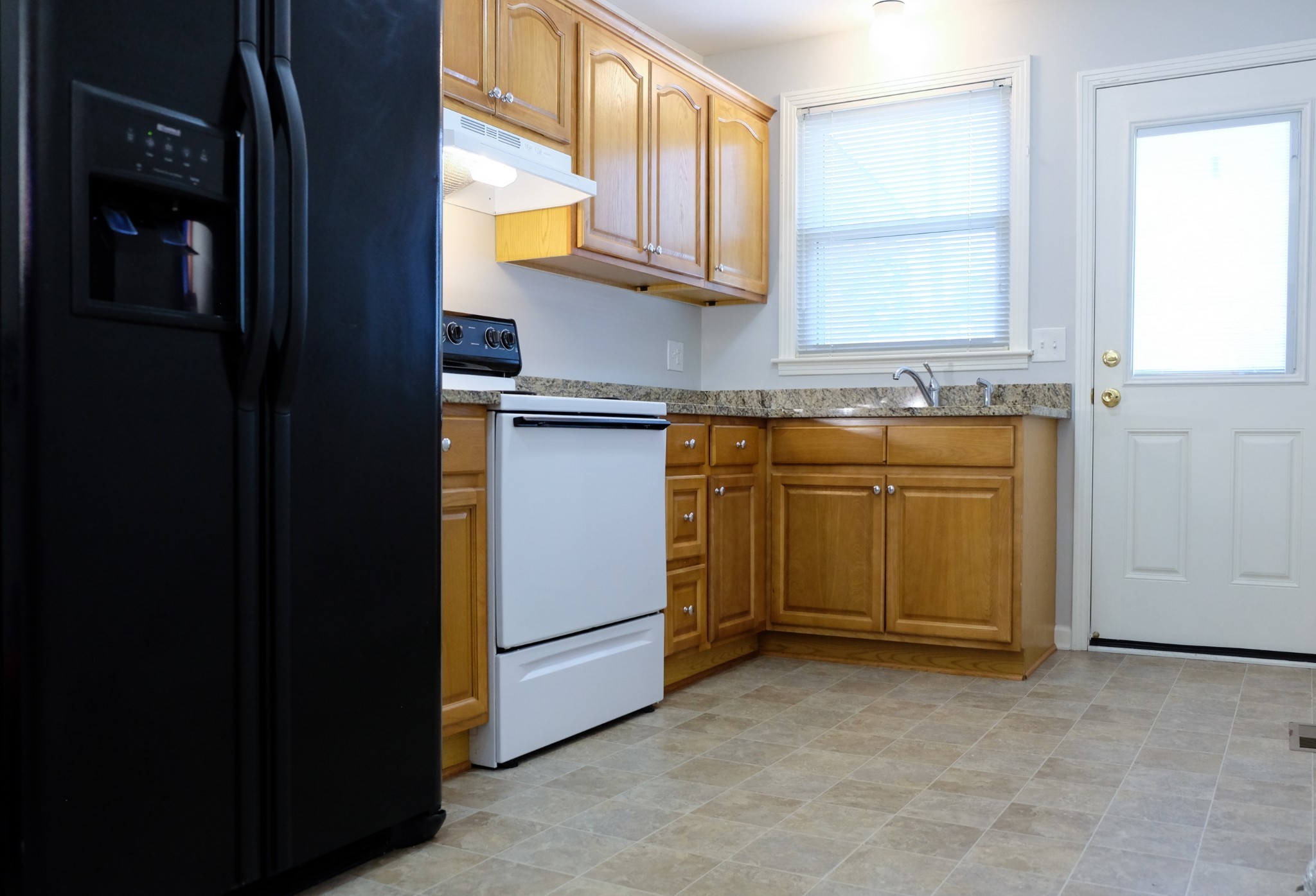 2810 Valley Road Nashville, TN 37215 - Photo 4 of 10 a utility room with stainless steel appliances granite countertop a sink and a window