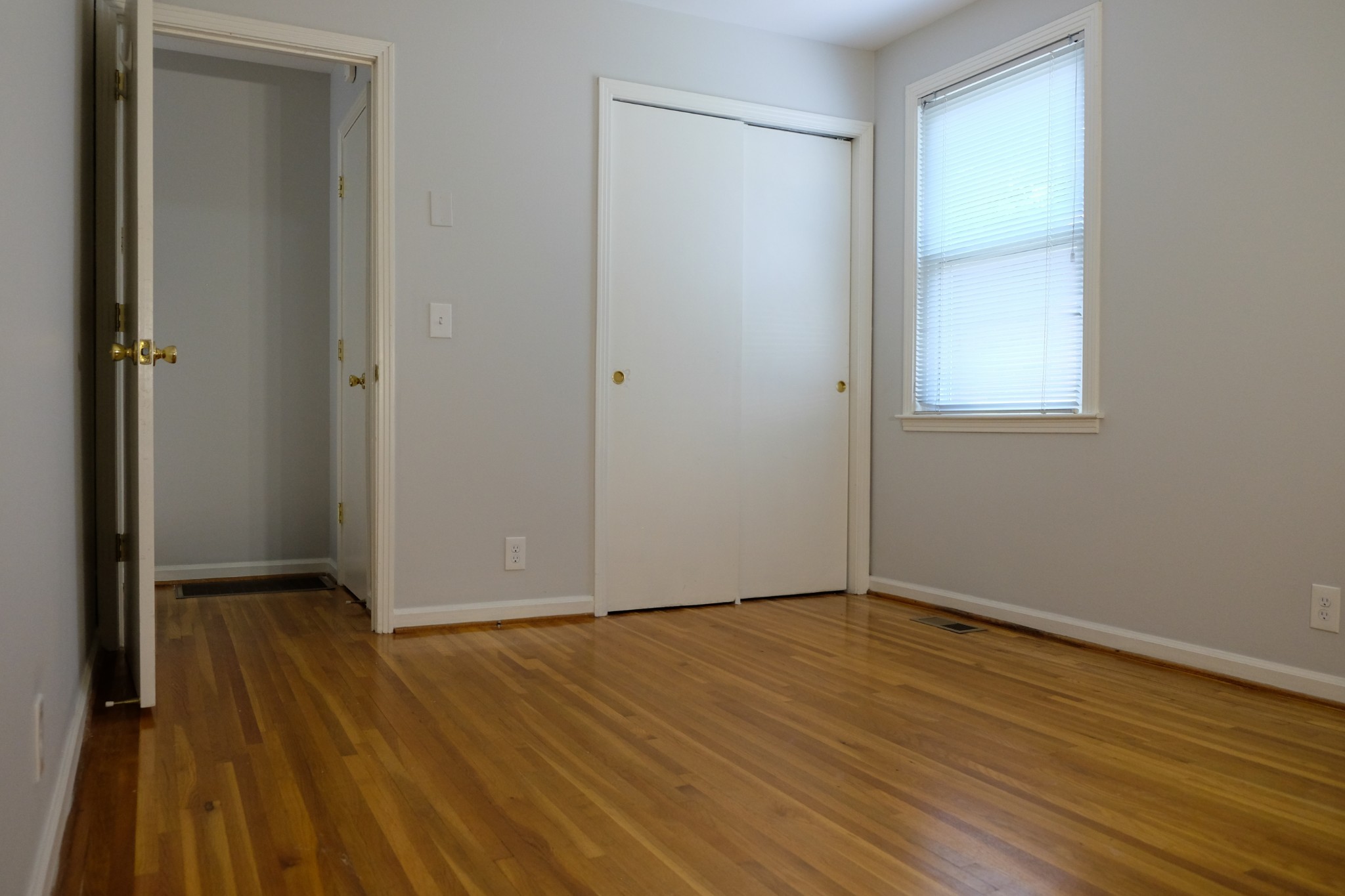 2810 Valley Road Nashville, TN 37215 - Photo 6 of 10 a view of an empty room with wooden floor and a window