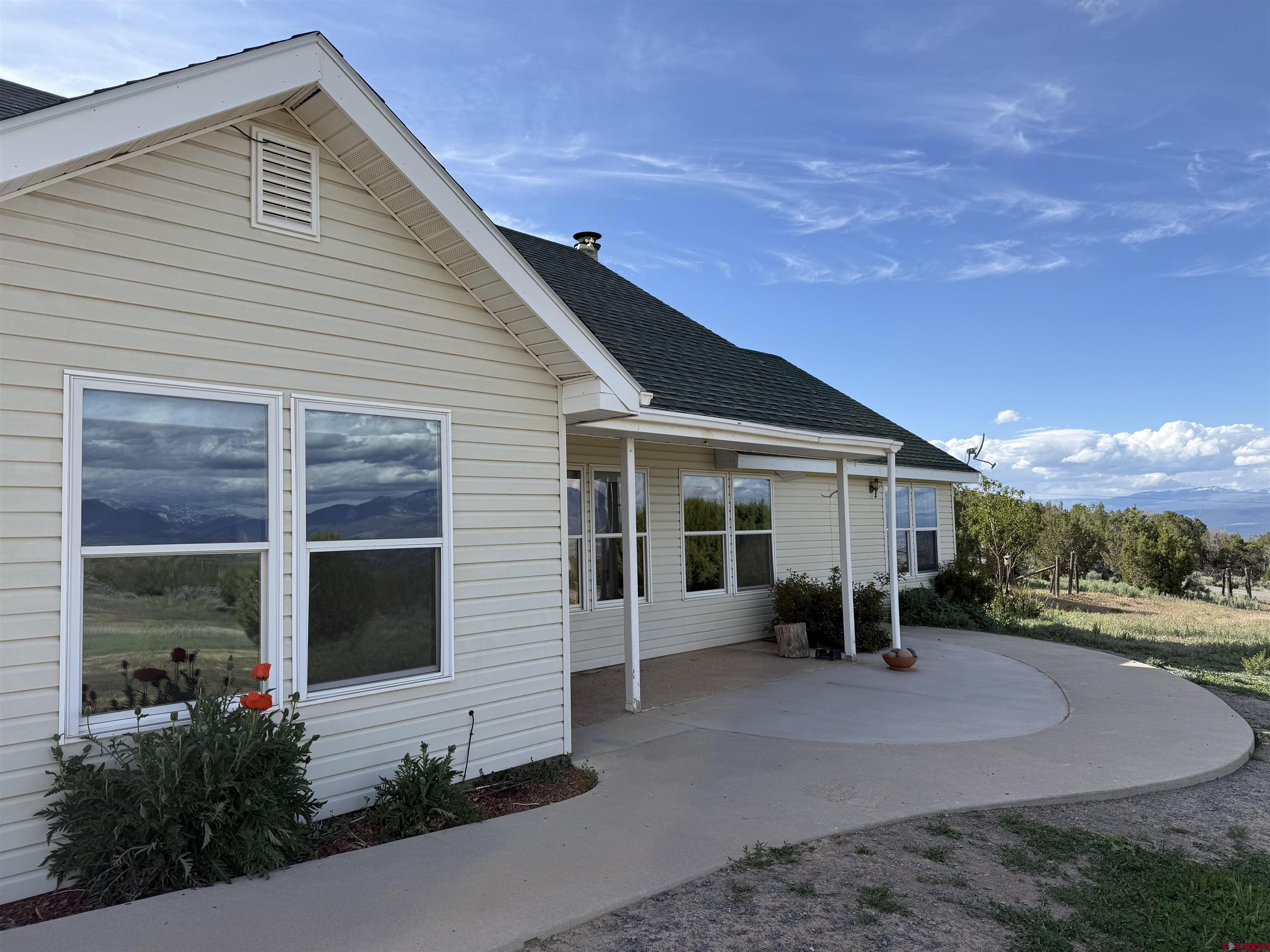 32310 B50 Road Crawford, CO 81415 - Photo 39 of 45 a front view of a house with a yard