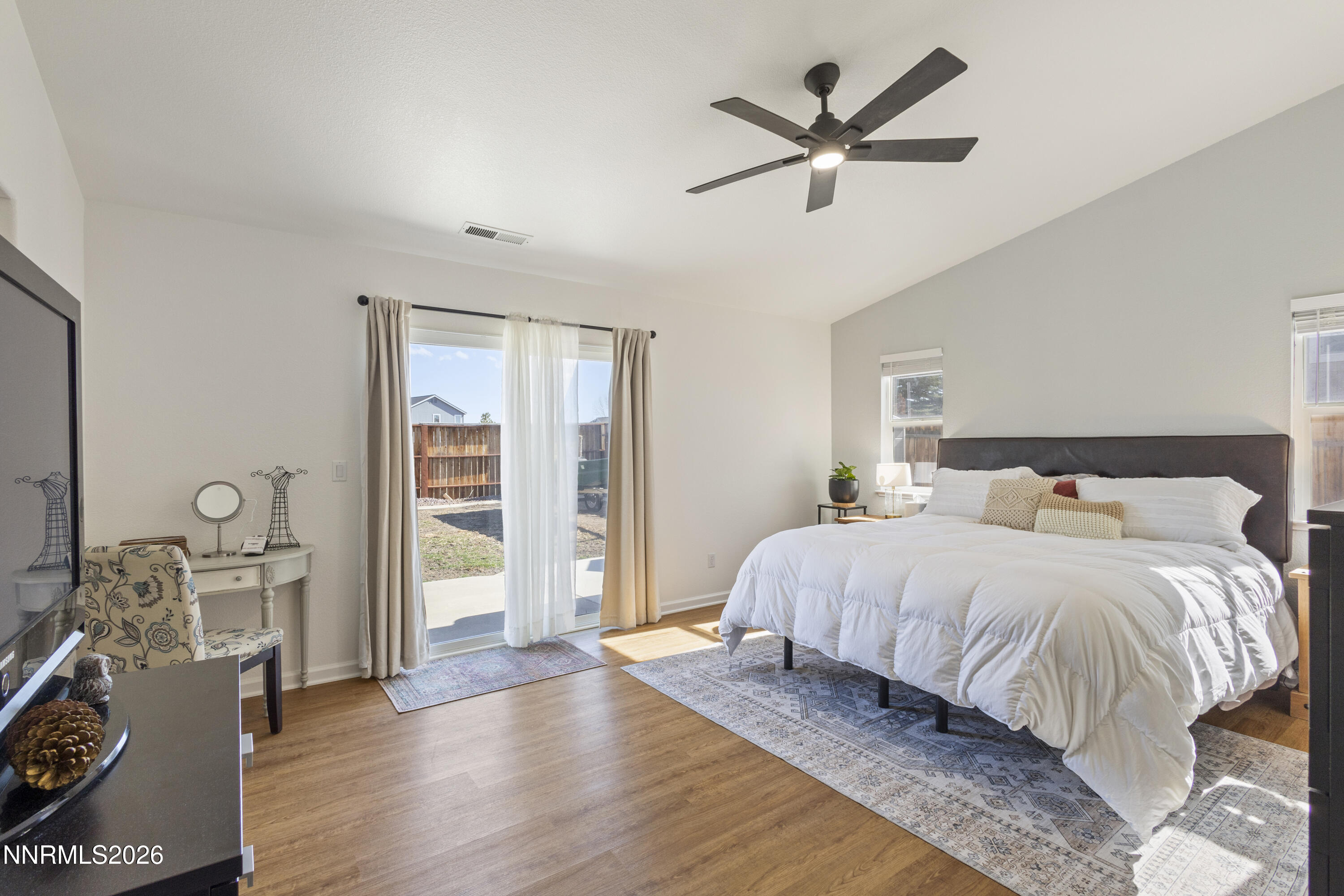 9834 Suncrest Drive Reno, NV 89506 - Photo 15 of 32 a bedroom with a bed and wooden floor