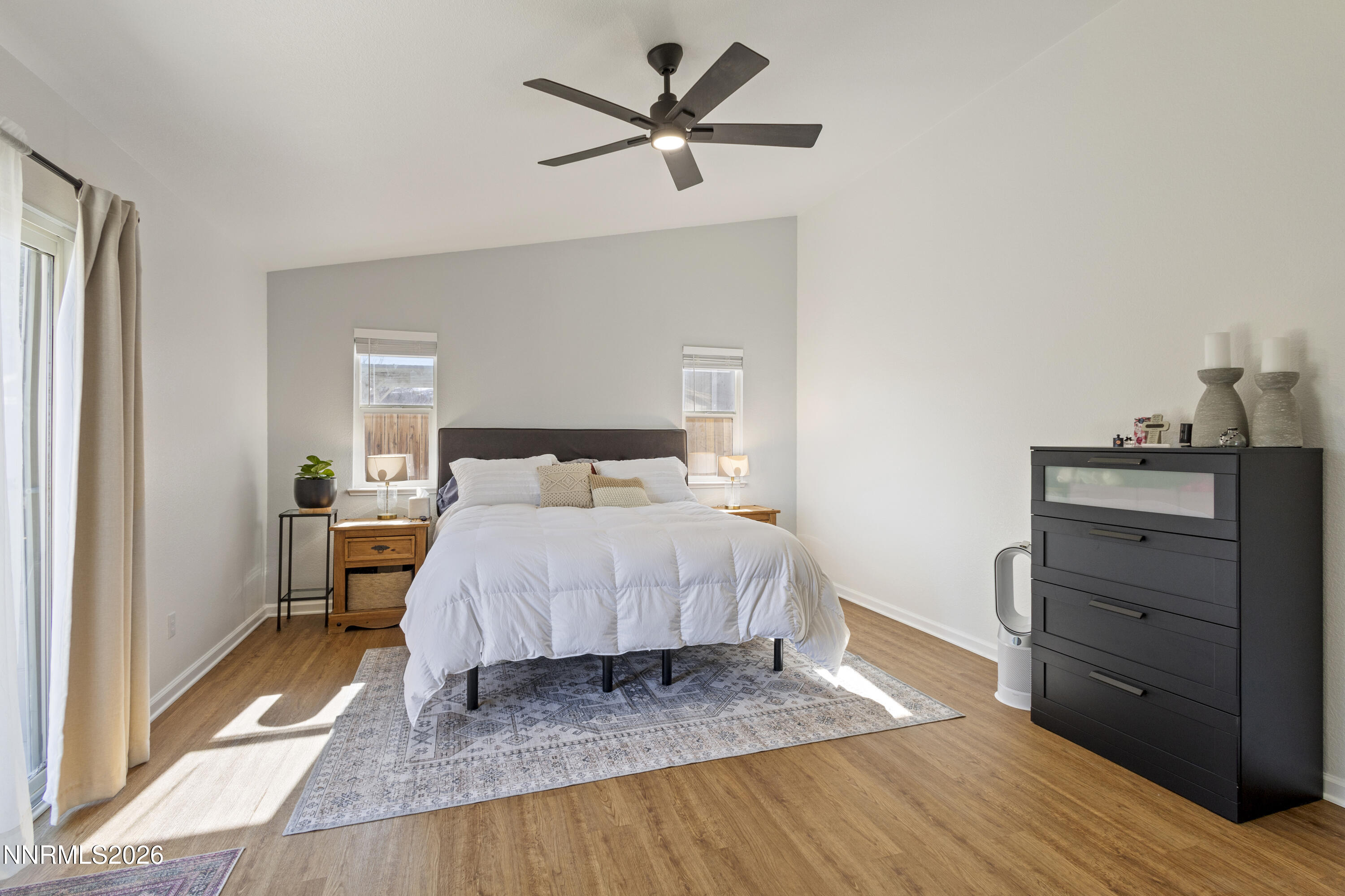 9834 Suncrest Drive Reno, NV 89506 - Photo 16 of 32 a bedroom with a bed and a dresser