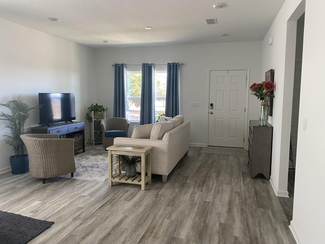 123 Staggerbush Street Freeport, FL 32439 - Photo 3 of 7 a living room with furniture and a wooden floor