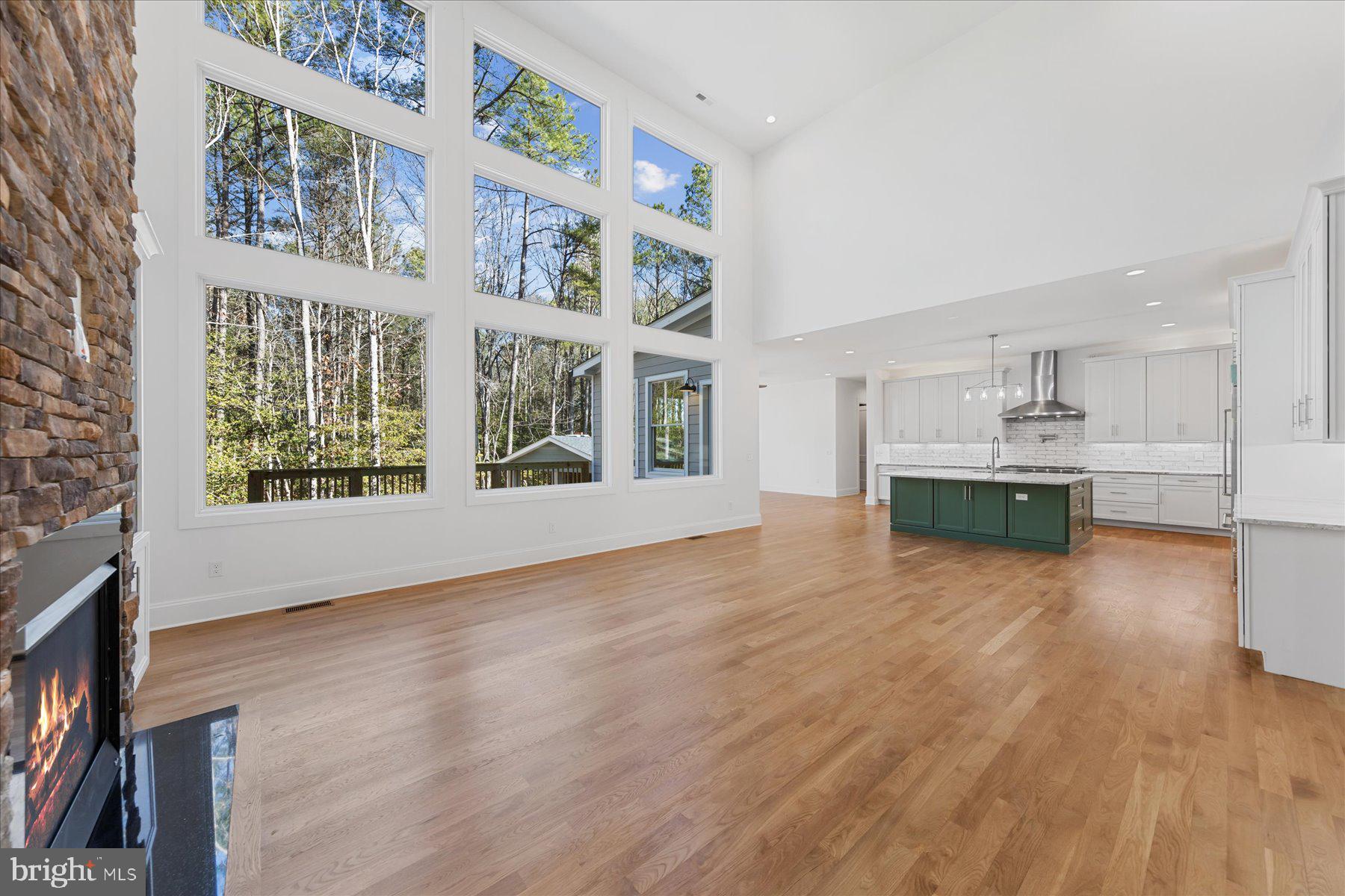 30425 Hollymount Road Harbeson, DE 19951 - Photo 14 of 98 a view of an empty room with a window and wooden floor