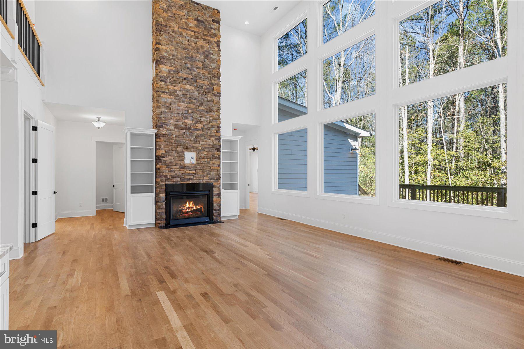 30425 Hollymount Road Harbeson, DE 19951 - Photo 15 of 98 a view of an empty room with wooden floor and a window