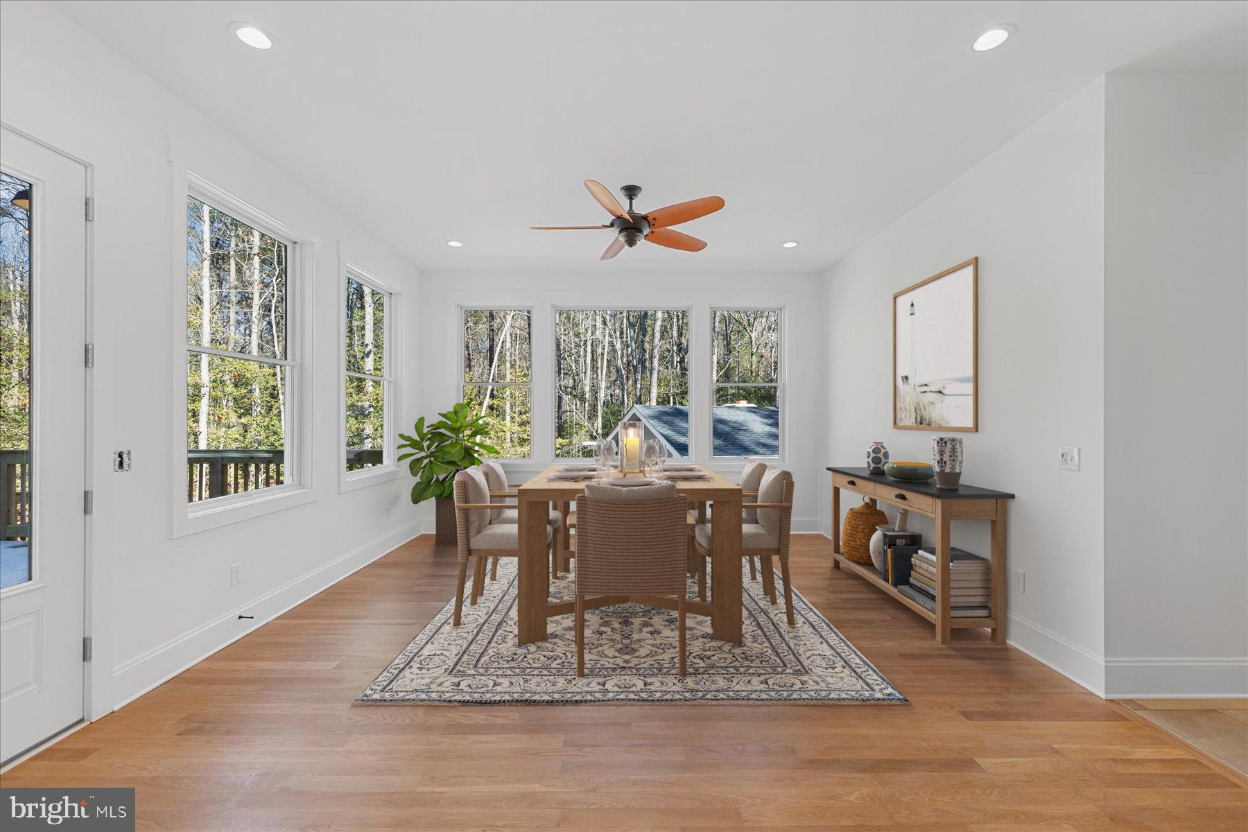 30425 Hollymount Road Harbeson, DE 19951 - Photo 27 of 98 a dining room with wooden floor and a rug