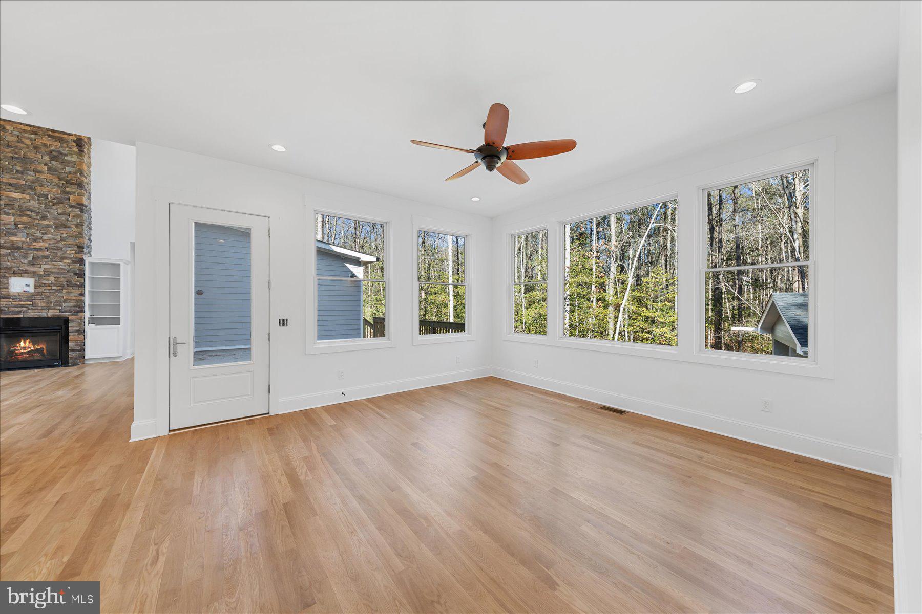 30425 Hollymount Road Harbeson, DE 19951 - Photo 28 of 98 a view of an empty room with wooden floor and a window