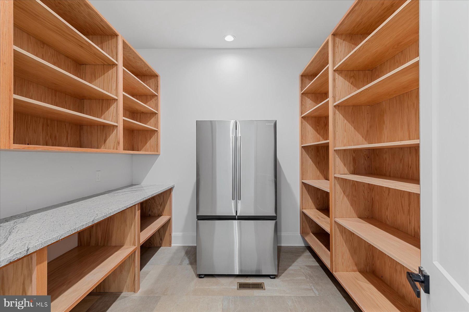 30425 Hollymount Road Harbeson, DE 19951 - Photo 31 of 98 a view of an empty room with empty shelves