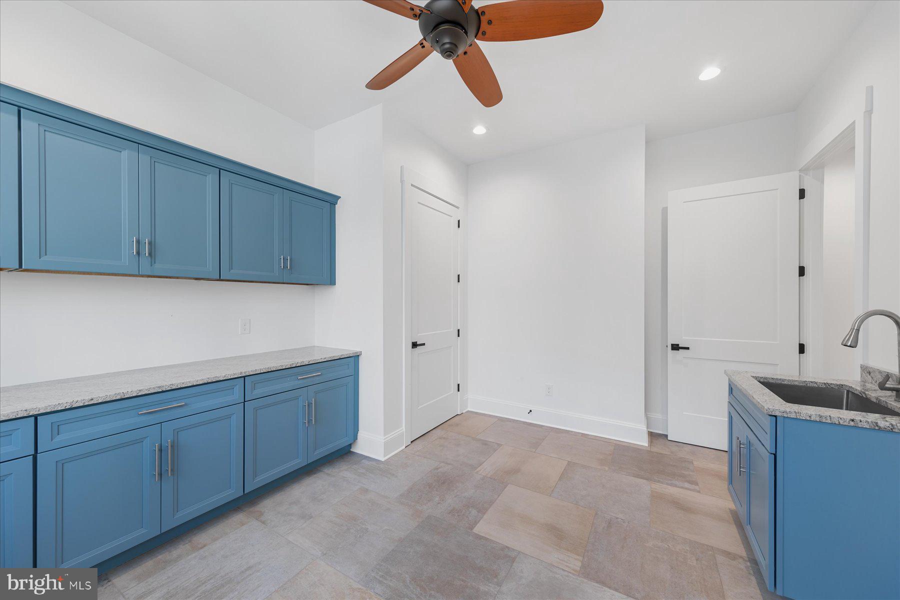 30425 Hollymount Road Harbeson, DE 19951 - Photo 33 of 98 a view of a kitchen with sink cabinets and wooden floor