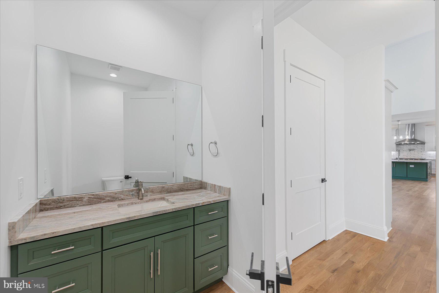 30425 Hollymount Road Harbeson, DE 19951 - Photo 35 of 98 a bathroom with a sink double vanity and a mirror