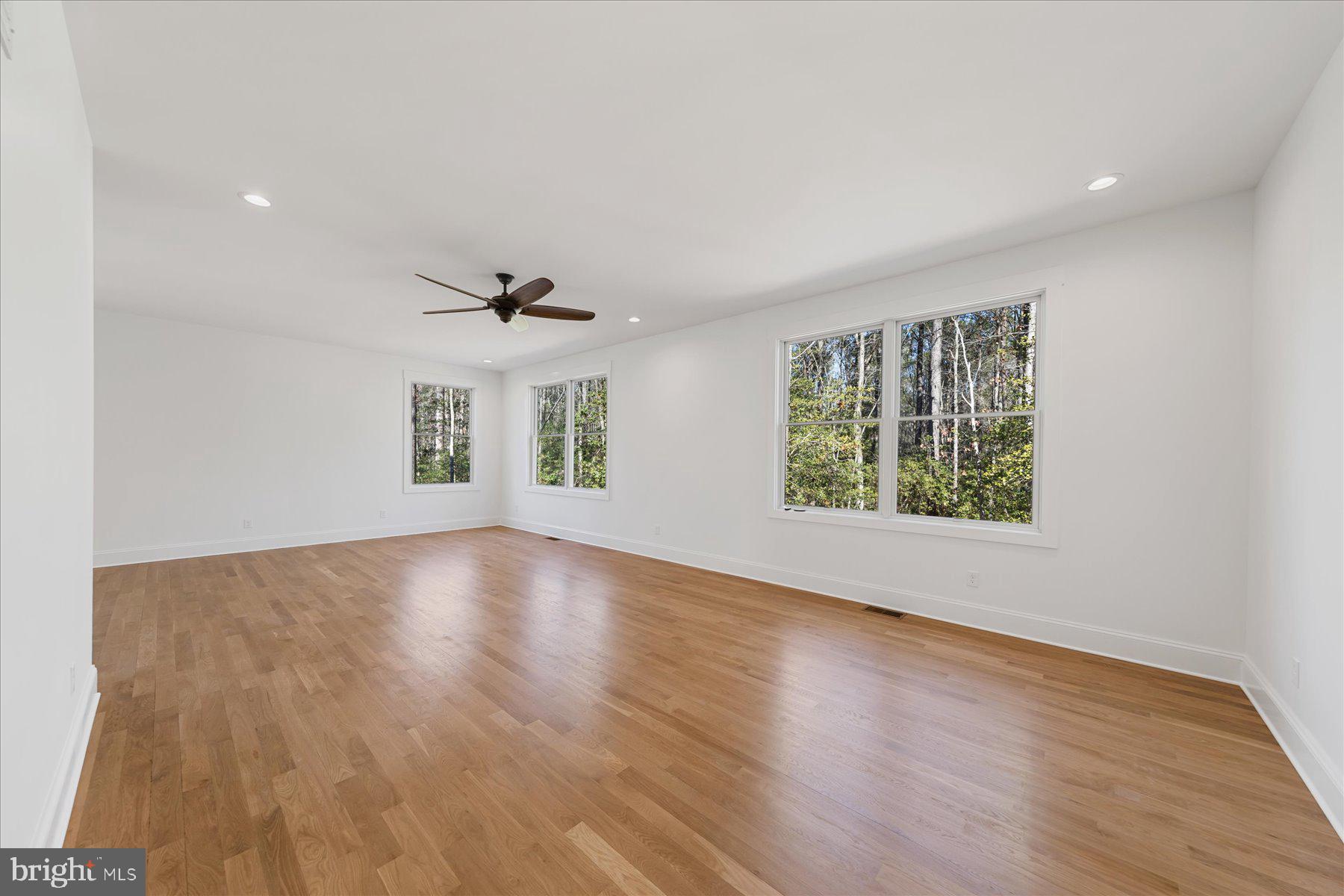 30425 Hollymount Road Harbeson, DE 19951 - Photo 36 of 98 an empty room with wooden floor and windows
