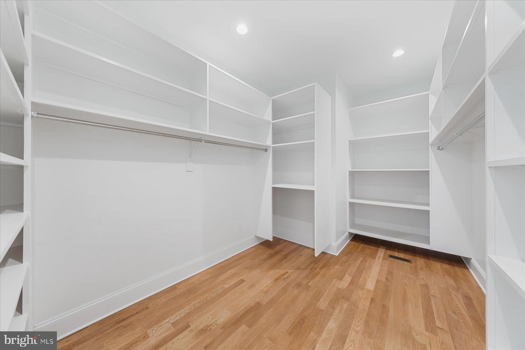 30425 Hollymount Road Harbeson, DE 19951 - Photo 39 of 98 a view of an empty room with a closet and wooden floor