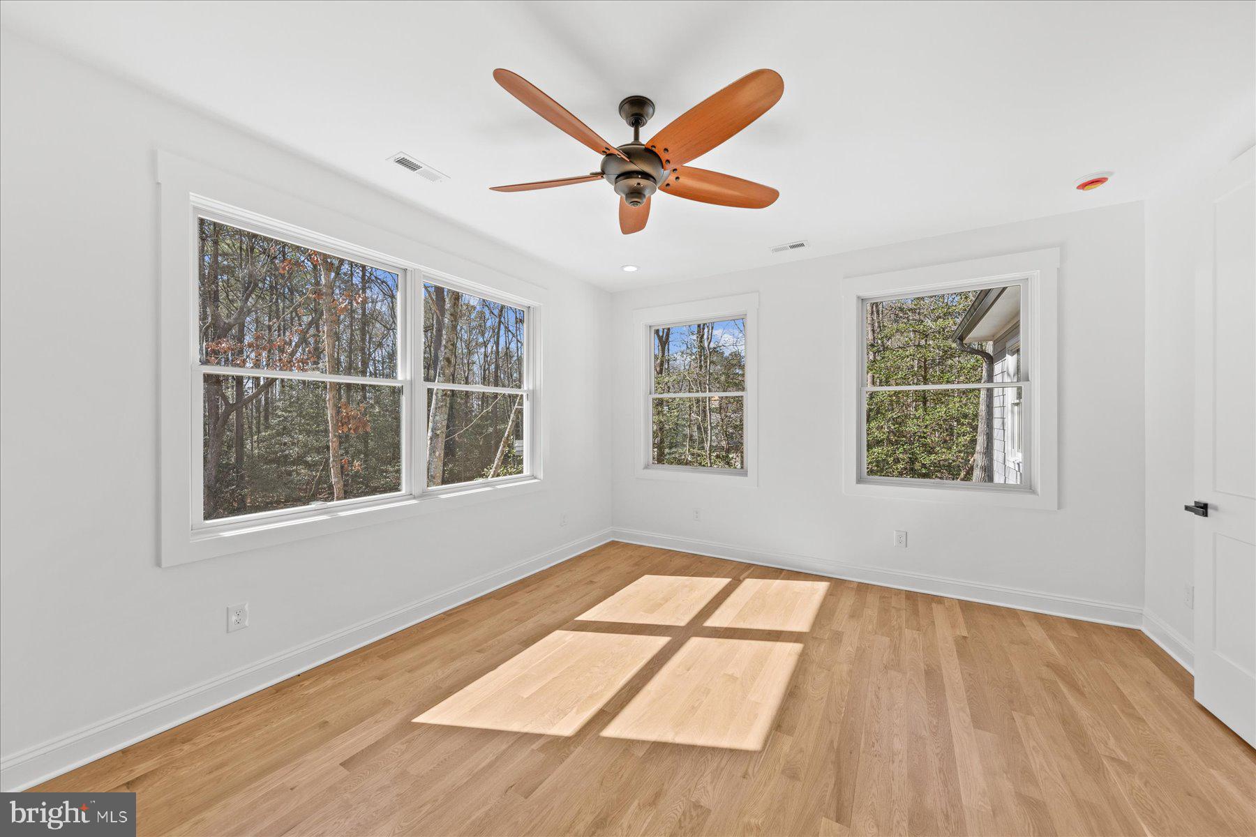 30425 Hollymount Road Harbeson, DE 19951 - Photo 55 of 98 a view of an empty room with wooden floor and a window