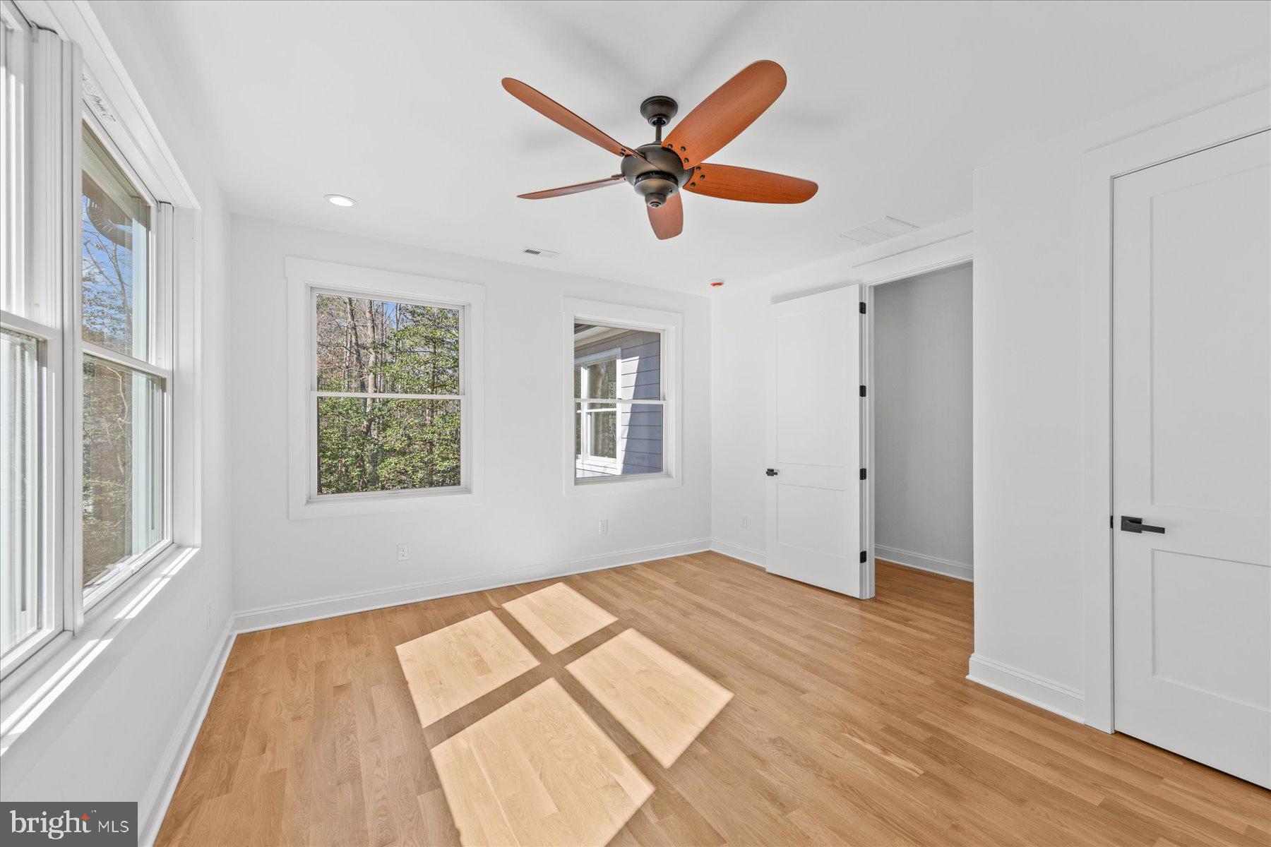 30425 Hollymount Road Harbeson, DE 19951 - Photo 56 of 98 a view of an empty room with wooden floor and a window