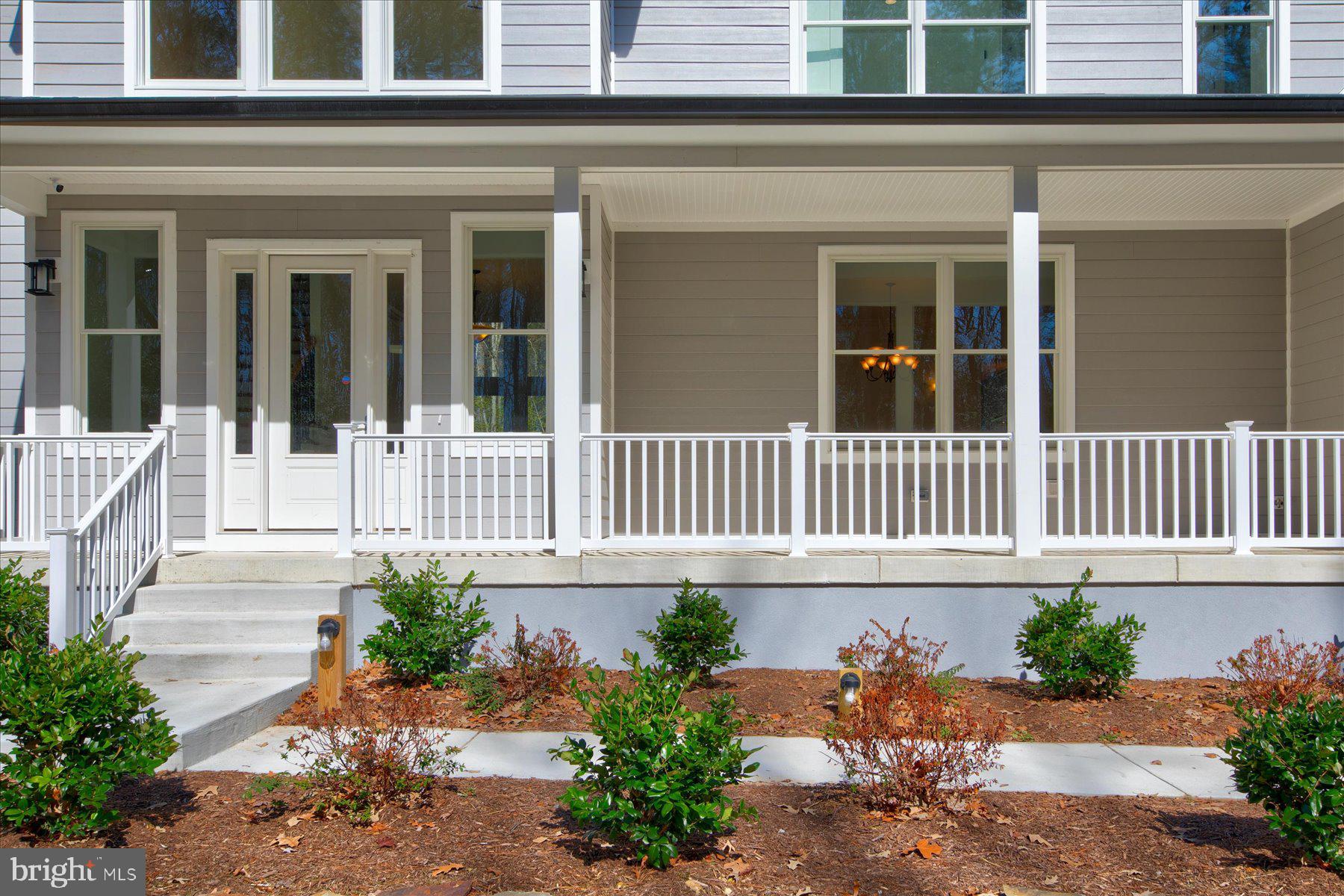 30425 Hollymount Road Harbeson, DE 19951 - Photo 6 of 98 front of a house with a yard