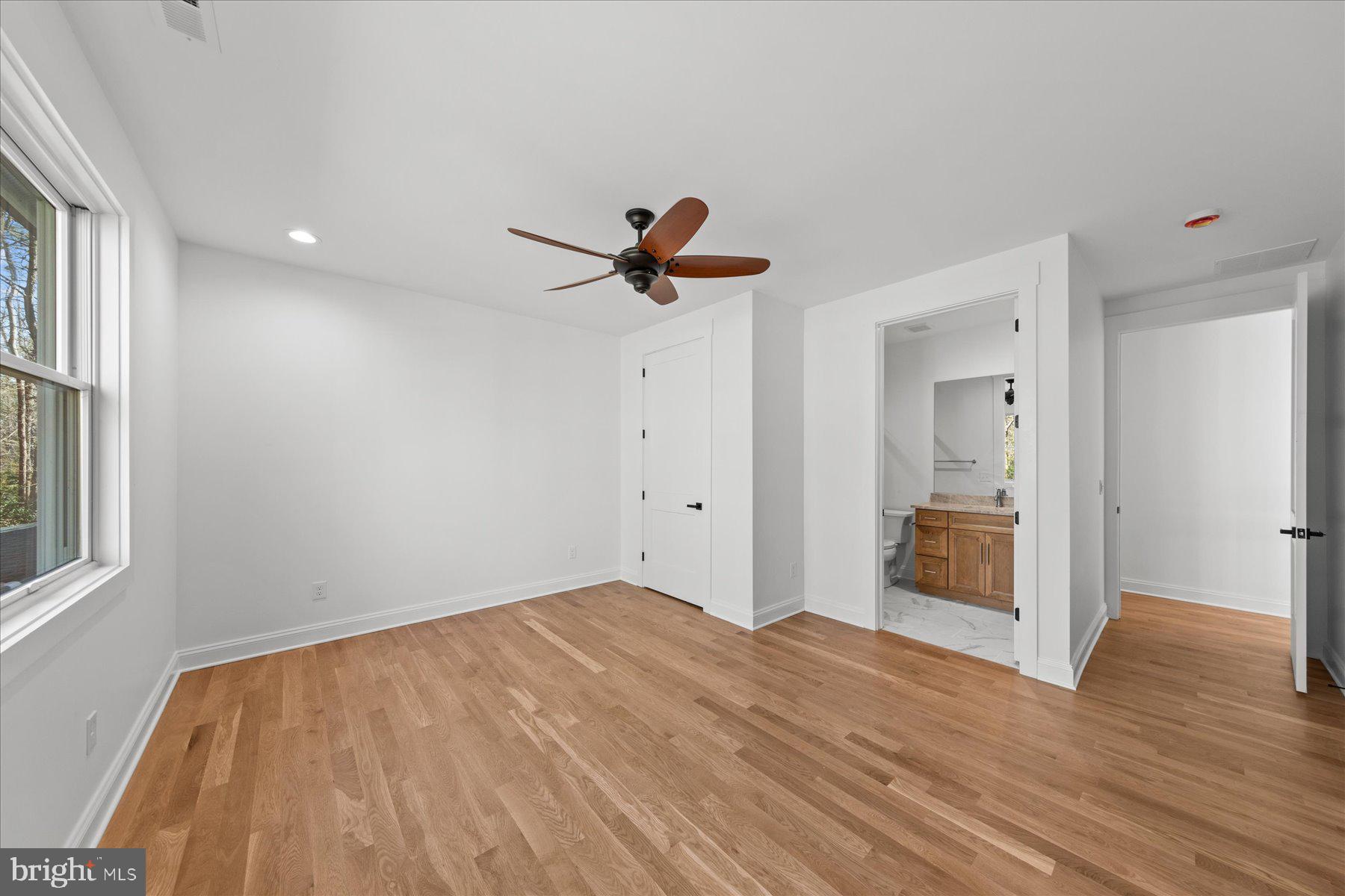 30425 Hollymount Road Harbeson, DE 19951 - Photo 66 of 98 a view of empty room with wooden floor and ceiling fan